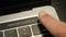 Human finger using fingerprint biometric scanner for secure access on laptop. Hi tech data security. User unlocks laptop with fing