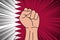 Human fist clenched symbol on flag of Qatar