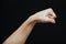 Human fist isolated in a black background