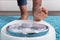 Human Foot Stepping On Weighing Scale