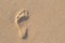 Human footprint on sand with amazing nature sun lightning. Can s
