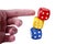 Human hand / finger pushing a tower like structure made of colorful game dices. Simple concept of no stability, demolition