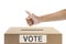 Human hand gesture after inserting vote paper into ballot box