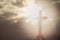 Human hand holding a cross, the background is the sunrise., Concept for Christian, Christianity, Catholic religion, divine, heave