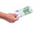 Human hand holding money, sharing one hundred 100 euro banknote. banknotes in financial, money exchange.