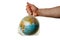 The human hand holds the planet earth in a plastic bag