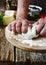 Human hand knead pizza dough