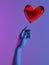 Human Hand Lightened With Blue And Pink Neon Lights Sending Red Heart Balloon. Proposal. Surprise. 3d rendering.