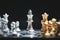 Human hand moving dark King chess piece at table