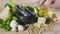 Human hand puts several cloves of garlic on the table. Ingredients for a sauce pesto.