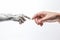 Human hand touching robot finger on white background