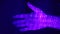 Human hand in ultraviolet light