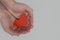 Human hands holding a red heart. Kindness, love, compassion and charity concepts