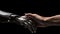 The human hands touch the robot\\\'s metallic hand. Concept of harmonious coexistence of humans and AI technology