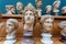 Human heads, marble copies of old Roman emperors and gods. Ancient history concept