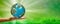 Human holding Earth in hands against green spring background and sun ray. Ecology concept, Panoramic view. Space for text