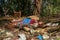 Human remains wrapped in colored cloth. Decomposing bodies lie on the surface. Traditional way of burial in Bali, Indonesia.