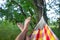 Human rest in a hammock in a forest