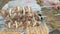 Human\'s hand strung pieces of raw meat on a skewer