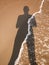Human shadow on the sand
