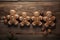 Human shaped gingerbread biscuit on wood board background for holiday season. Winter seasonal concept.