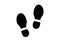 Human shoe footprints. Pair of prints of boots. Left and right leg. Shoe sole. Walking foot steps. Silhouette. Black and