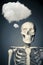 Human skeleton thinking on a grey background