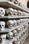 Human skulls inside a catacomb.