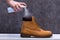 Human Spraying Deodorant On Shoes