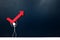 Human stick figure carrying a red arrow pointing upward. Economy bounce back and recovery concept.