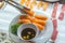 Human using tongs picking salmon nigiri sushi in Japanese restaurant