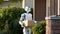 humanoid robot delivering a box to a house. future concept