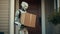 humanoid robot delivering a box to a house. future concept