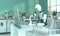 A humanoid robot in a laboratory works with a microscope. Scientific experiments. Future concept with smart robotics and