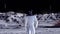 A humanoid robot walks across the moon\'s surface. Lunar colony. 3D rendering.