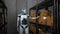 Humanoid robot works in a shipping warehouse