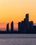 The Humber Bay Shores skyline silhouetted in front of a warm vibrant colorful sunset