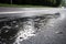 humid summer day with wet asphalt surface and droplets forming