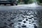 humid summer day with wet asphalt surface and droplets forming