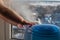 Humidifier producing a vapor with a baby`s hands