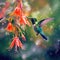 Hummingbird is perched on flower, enjoying nectar from its blossom. The bird\\\'s wings are spread out and it appears to