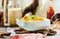 Hummus, chickpea dip, with rosemary, smoked paprika and olive oil on a wooden background. Rustic. Healthy lifestyle and balanced