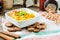 Hummus, chickpea dip, with rosemary, smoked paprika and olive oil on a wooden background. Rustic. Healthy lifestyle and balanced