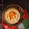 Hummus, chickpea dip, with variety vegetables sticks, dark background, copy space. Middle Eastern vegan pate side dish, delicious