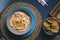 Hummus chickpea served on a plate with dipping toasts