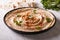 Hummus with parsley on the plate close-up and pita bread