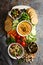 Hummus and vegetables platter with grain salad