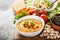 Hummus and vegetables platter with grain salad