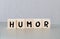 humor word written on wood block