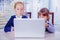 Humorous image of young child business girls Ñhatting with colleague